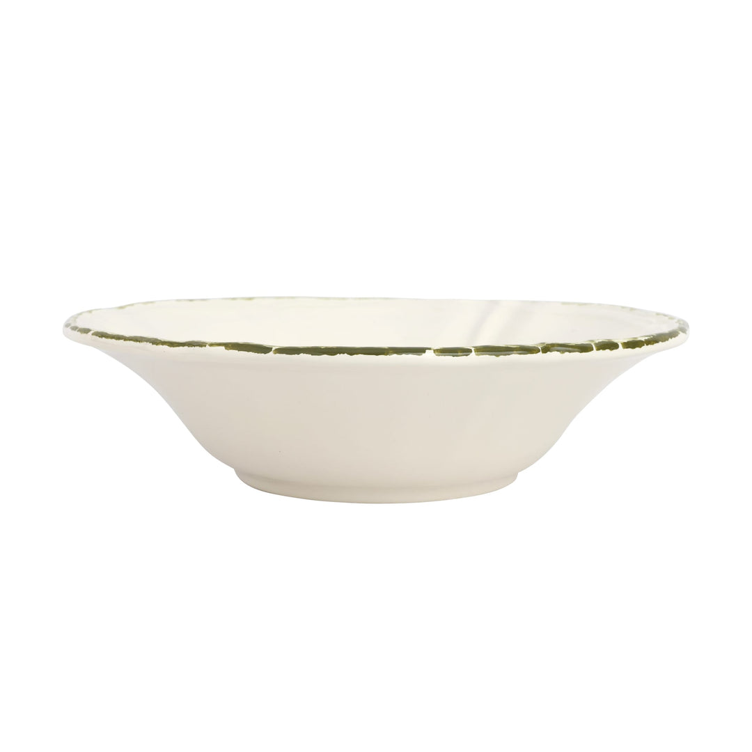 White ceramic serving bowl with a green rim on a white background