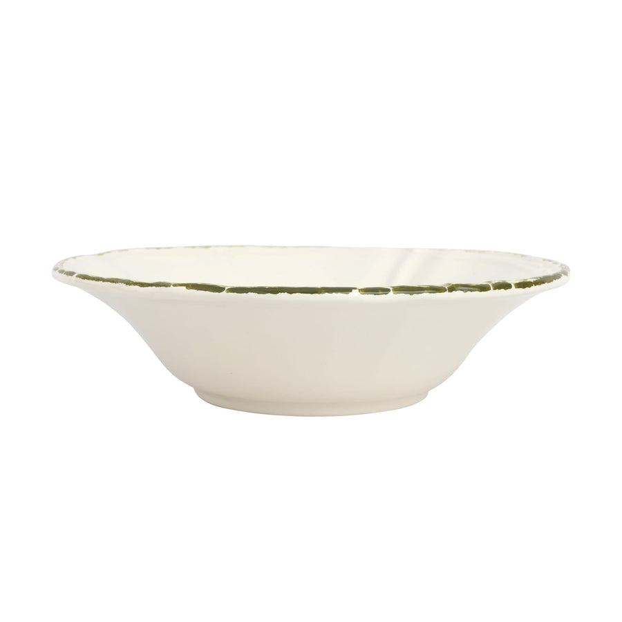 White ceramic serving bowl with a green rim on a white background
