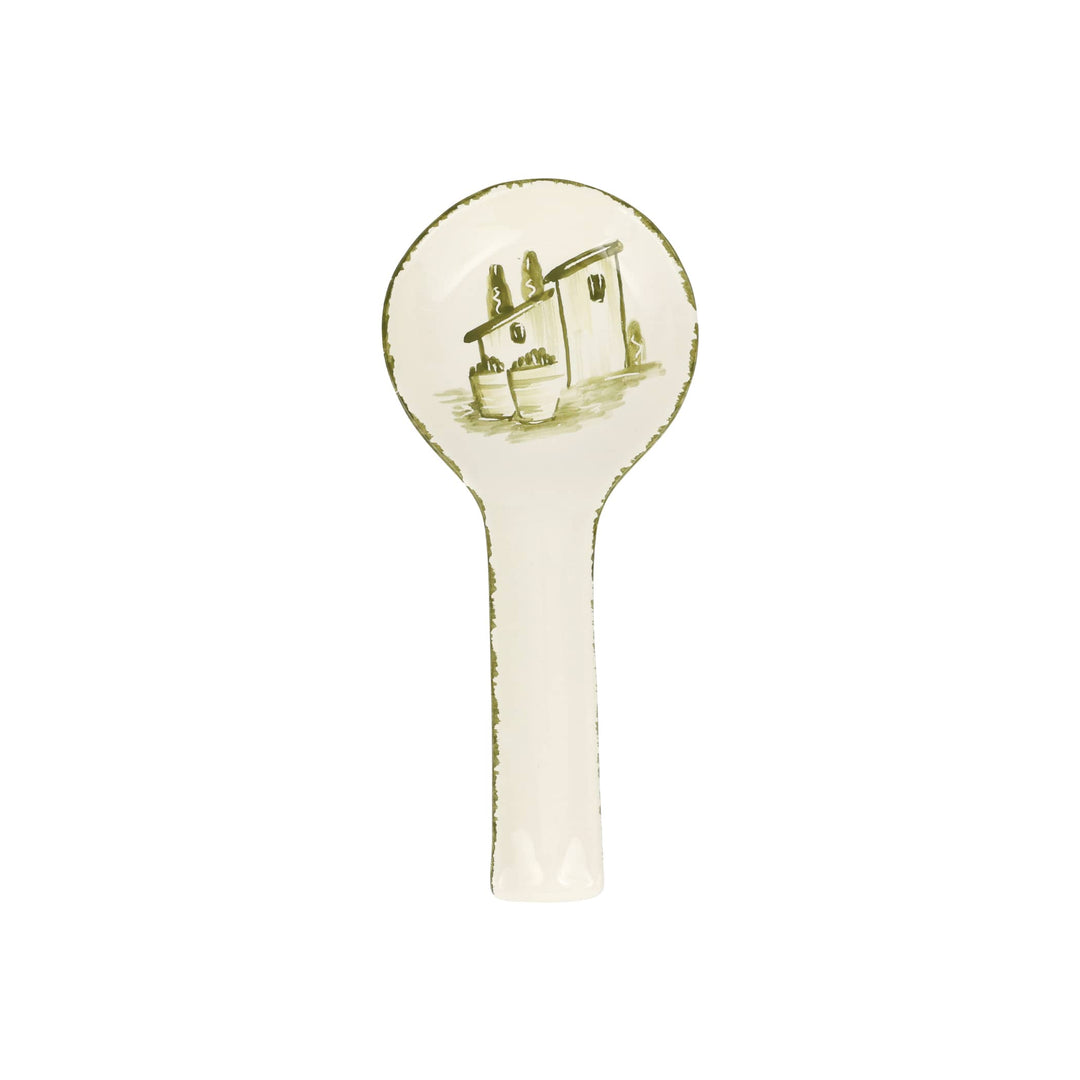 Decorative spoon rest with a house design on a white background