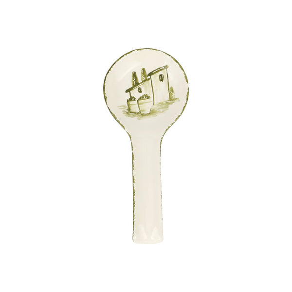 Decorative spoon rest with a house design on a white background