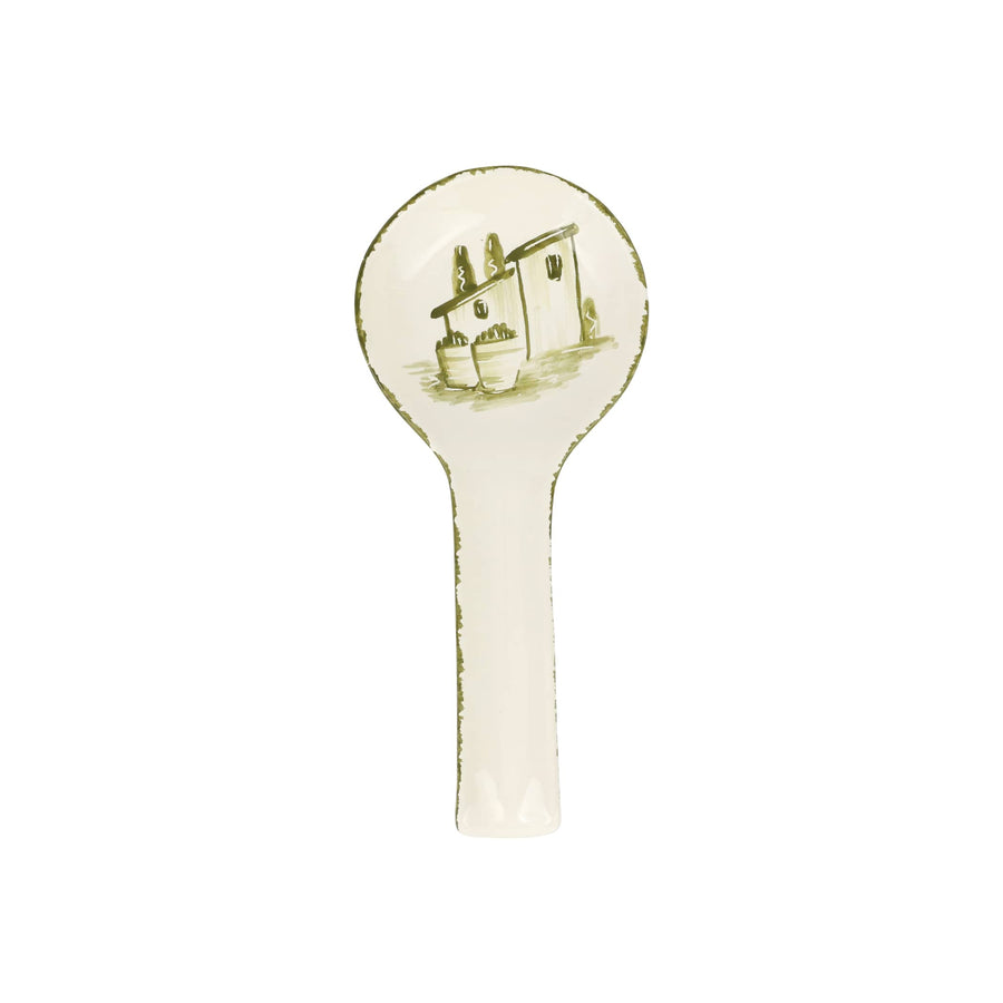 Decorative spoon rest with a house design on a white background
